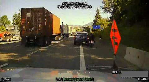 A motorcycle passing on the right in the moments before it collided with a blue pickup on Highway #1 in Vancouver